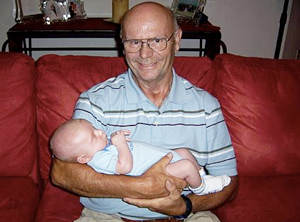 Dad holding grandson Connor for the first time! He's so proud of Helen and Adam!